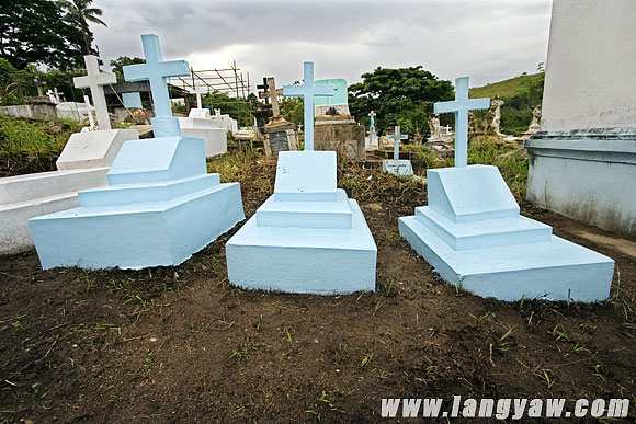 Newly painted graves at the cemetery