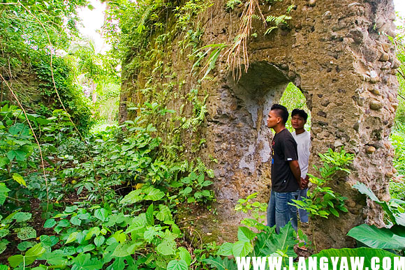 A ruined church in Lagonoy, Camarines Norte, with a date inscribed 1768, stands in the middle of a calamansi plantation overlooking the mouth of the river. Most likely a casualty of a raid, the present church, circa 19th century stands less than a kilometer inland.