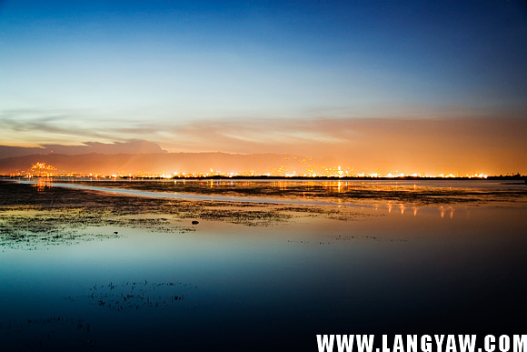 Cebu City lights cast an orange hue as dusk settles in.