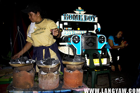 Preparing the bibingka  just outside the church