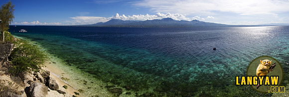 At the southern tip of Cebu, the familiar mountains of Southern Negros dominated by the Cuernos de Negros Mountains or Horns of Negros.