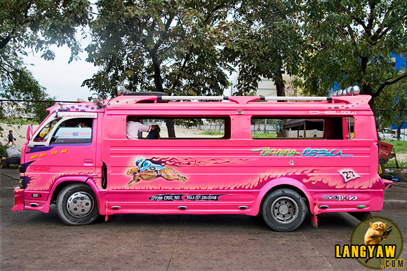 Bright and bold, a typical jeepney in Cebu sporting colorful paint and images