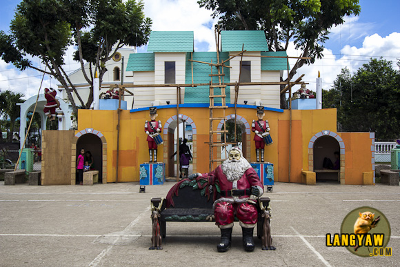 A seating Santa is just one of several sculptures that abound in the town plaza of Mulanay, Quezon
