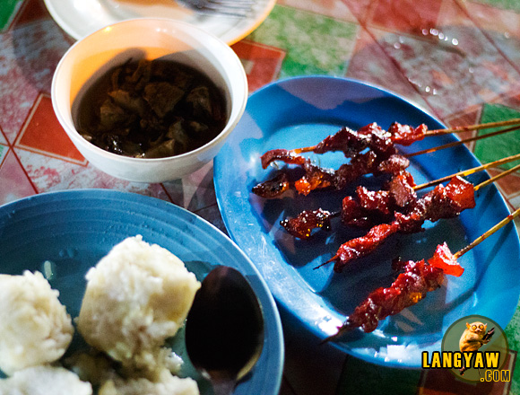 Puso rice, pork barbecue and halang halang