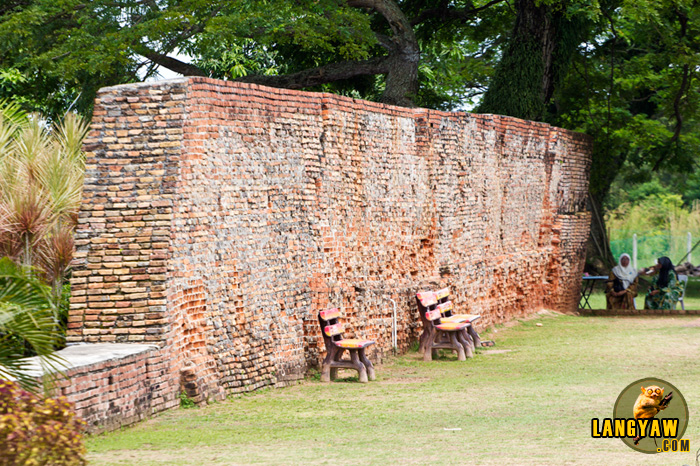 Fort walls make as a backdrop for park benches