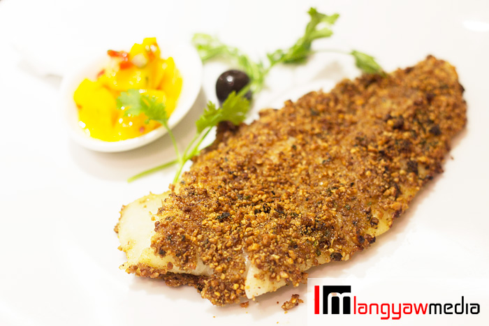 Herb encrusted fish with lemon and mango salsa
