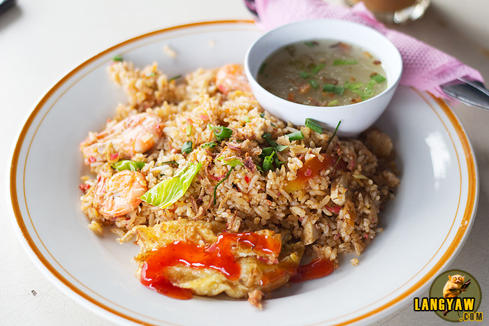 Nasi kandar salam with its mint sauce, a piece of fried chicken and rice fried with tomatoes, tomato sauce, sugar and chili