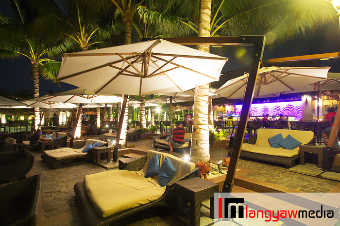 Enjoy the cool breeze while lounging or having drinks from Azure Pool Bar