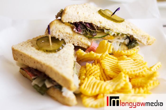 Crab salad in whole wheat flour sandwich with chips