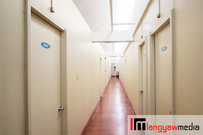 Hallway of the private aircon rooms with en suite toilet and bath