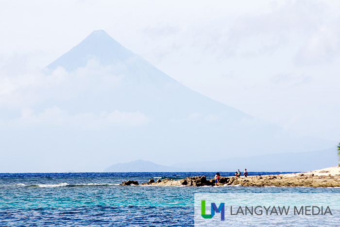 The northern rocky portion of Aguirangan Island with Mt. Mayon in the background