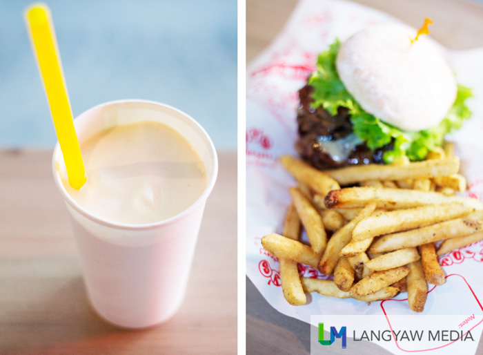 Left, thick peanut butter milk shake is 90% ice cream and 10% milk! Right, delicious garlic flavored fries 