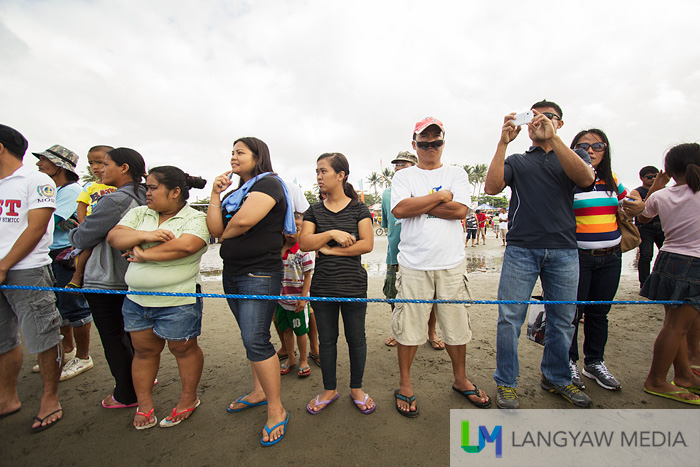 Cordoned off, onlookers at the regatta