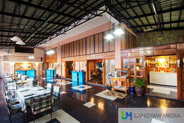 The partially covered veranda of the hotel where one can dine. It has great views of the capital town below.