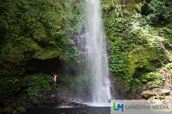 A small cavity near the pool of Balang Falls. Our tall and hunky guide gives scale to the size of the waterfalls