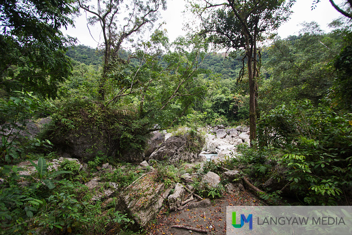 A break in the greens shows the white rocks and got me elated as, after more than 2 hours of trek and raft ride, we've finally arrived!