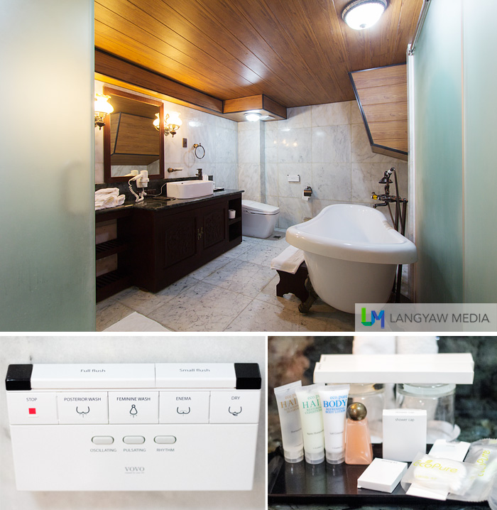 The spacious toilet and bath that includes a gorgeous tub and an ultramodern toilet. Below left, controls for the toilet; right, bath amenities.