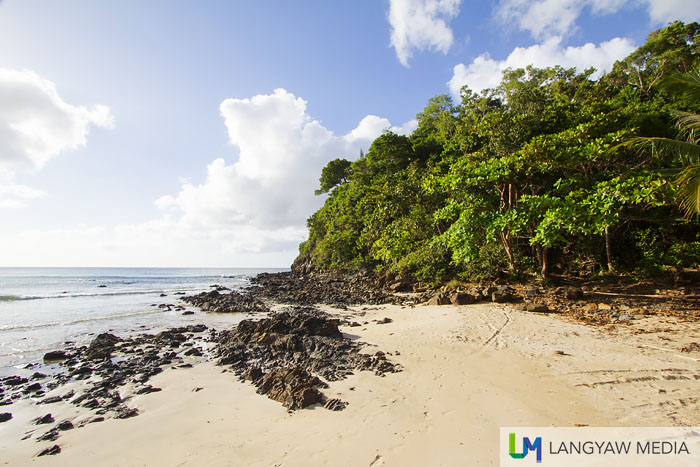 At the right end of the beach is this rugged area which is just a stone's throw from Caroline's Secret Resort