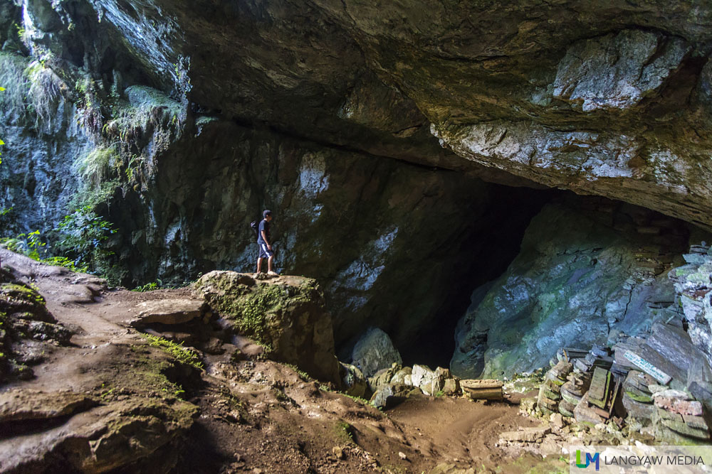 Lumiang Cave is known for the stacks of wooden coffins made from tree trunks at the opening